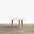 24" Round Coffee Table with Off-White Top and Tapered Wood Legs